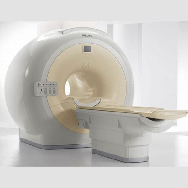 A white mri machine with two sections of the same color.